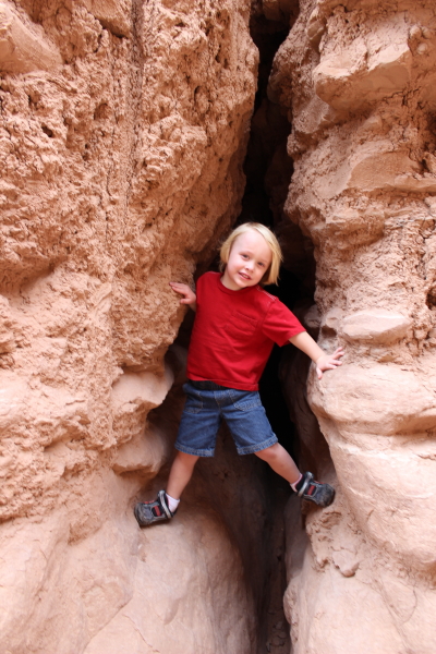 Toren climbing among the rocks.