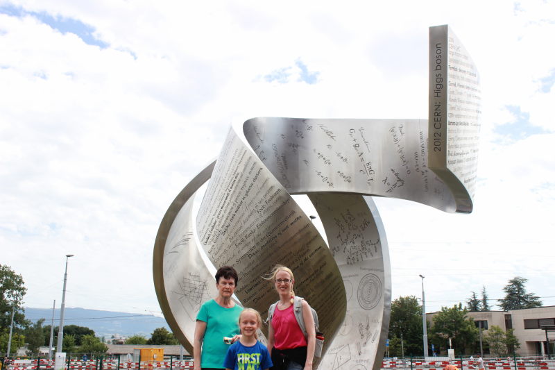 Rosemary, Toren, and Debi by a monument at CERN.
