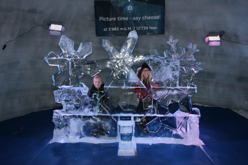Toren and Debi by an ice sculpture inside the glacier.